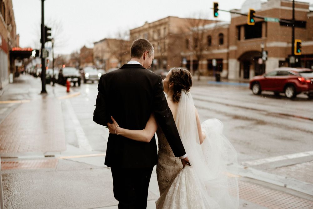Sepia toned urban street scene with couple walking together.