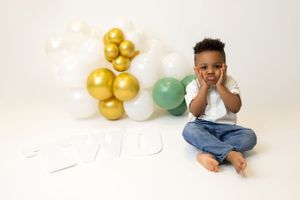 Milestone photoshoot featuring a child captured in a bright, cheerful studio.”