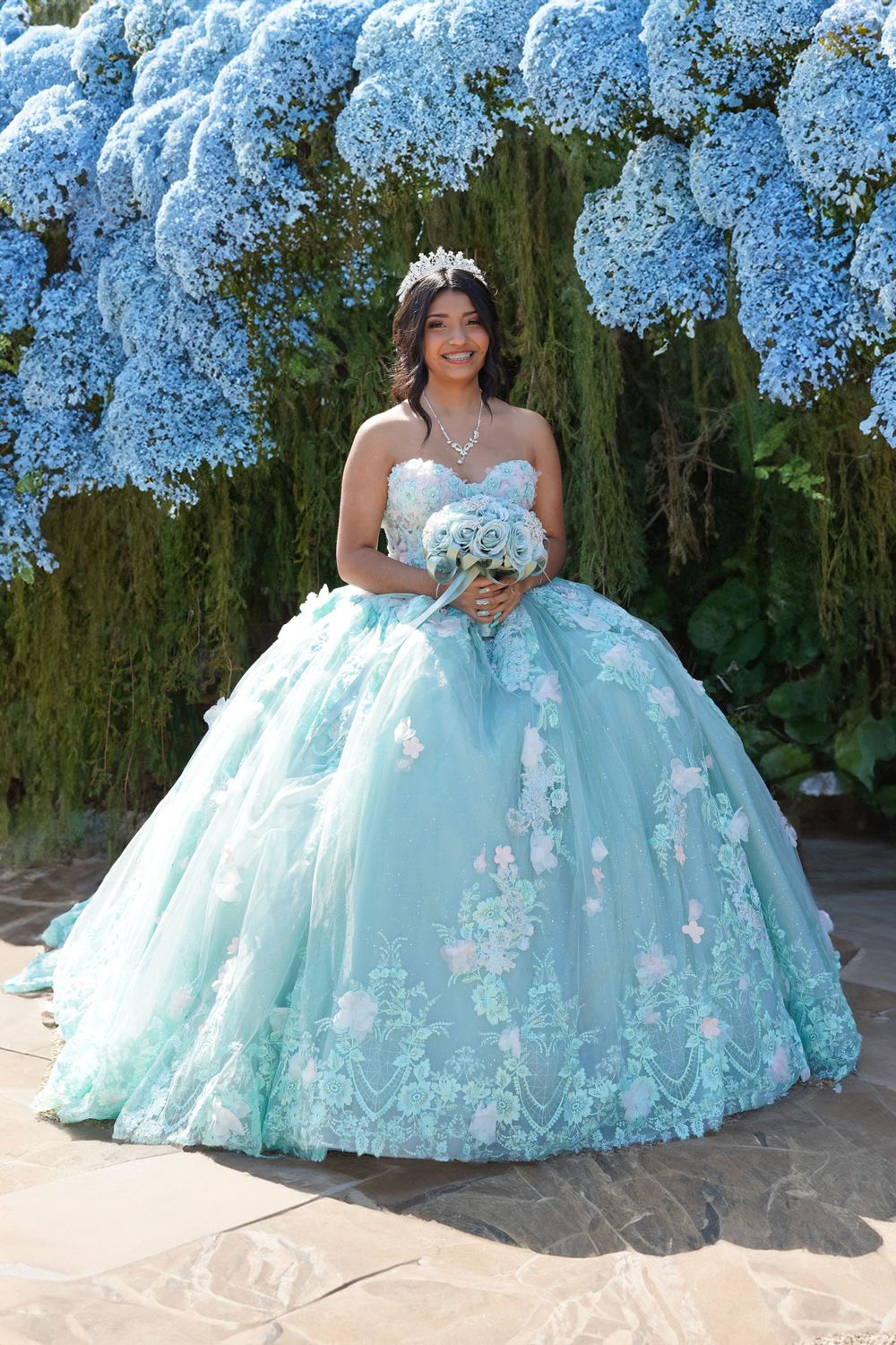 princess in front of floral arch