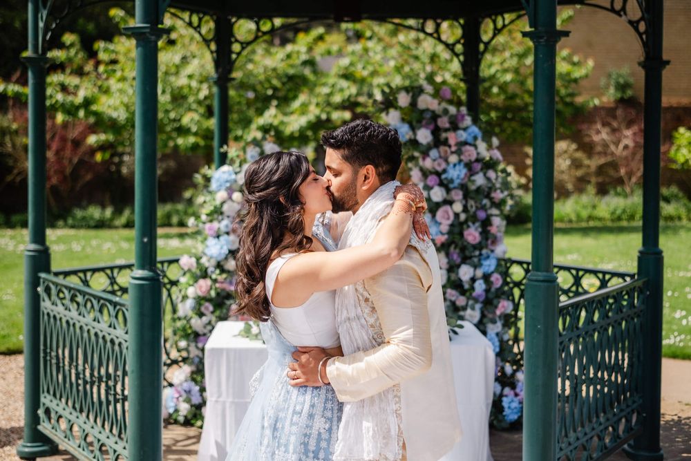 bride and groom kiss at wedding venue in Kent