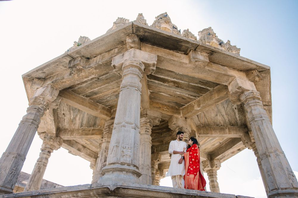 Ancient stone pavilion with ornate columns and architectural details at Hampi, Karnataka, India.