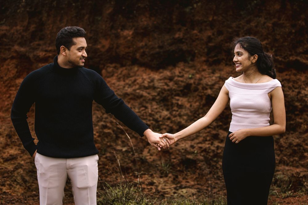 Couple in casual outfits sharing intimate moments against an earthy brown backdrop.