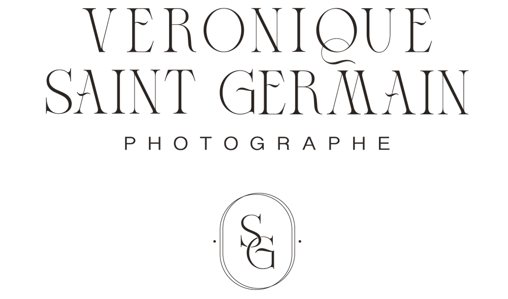 Black text logo for Veronique Saint Germain Photographe with minimalist oval emblem.