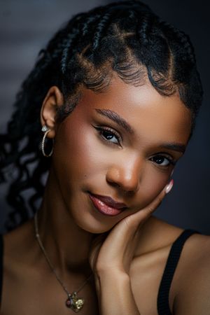A series of artistic portrait photographs showing different angles and expressions against a dark background.