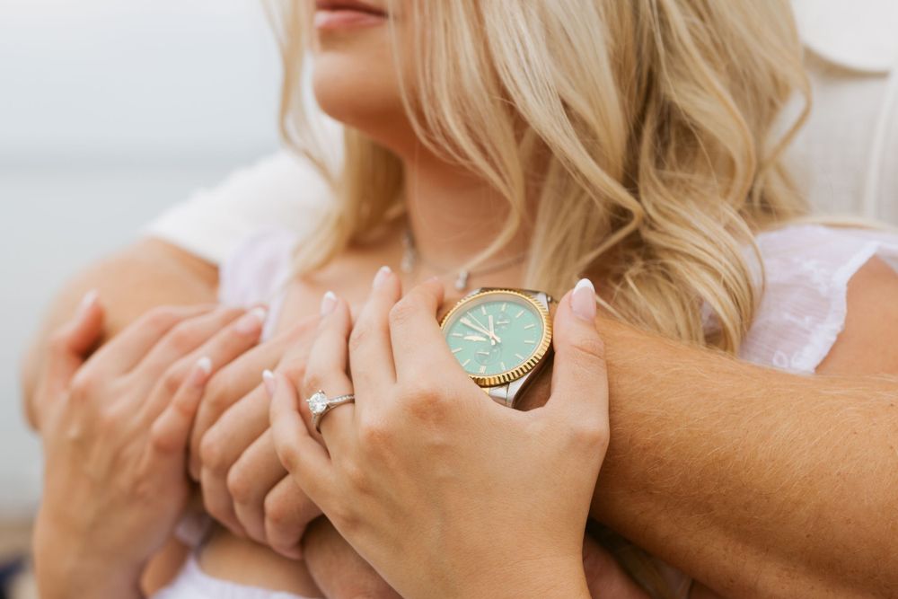 close up of watch and ring that couple is wearing during engagement session