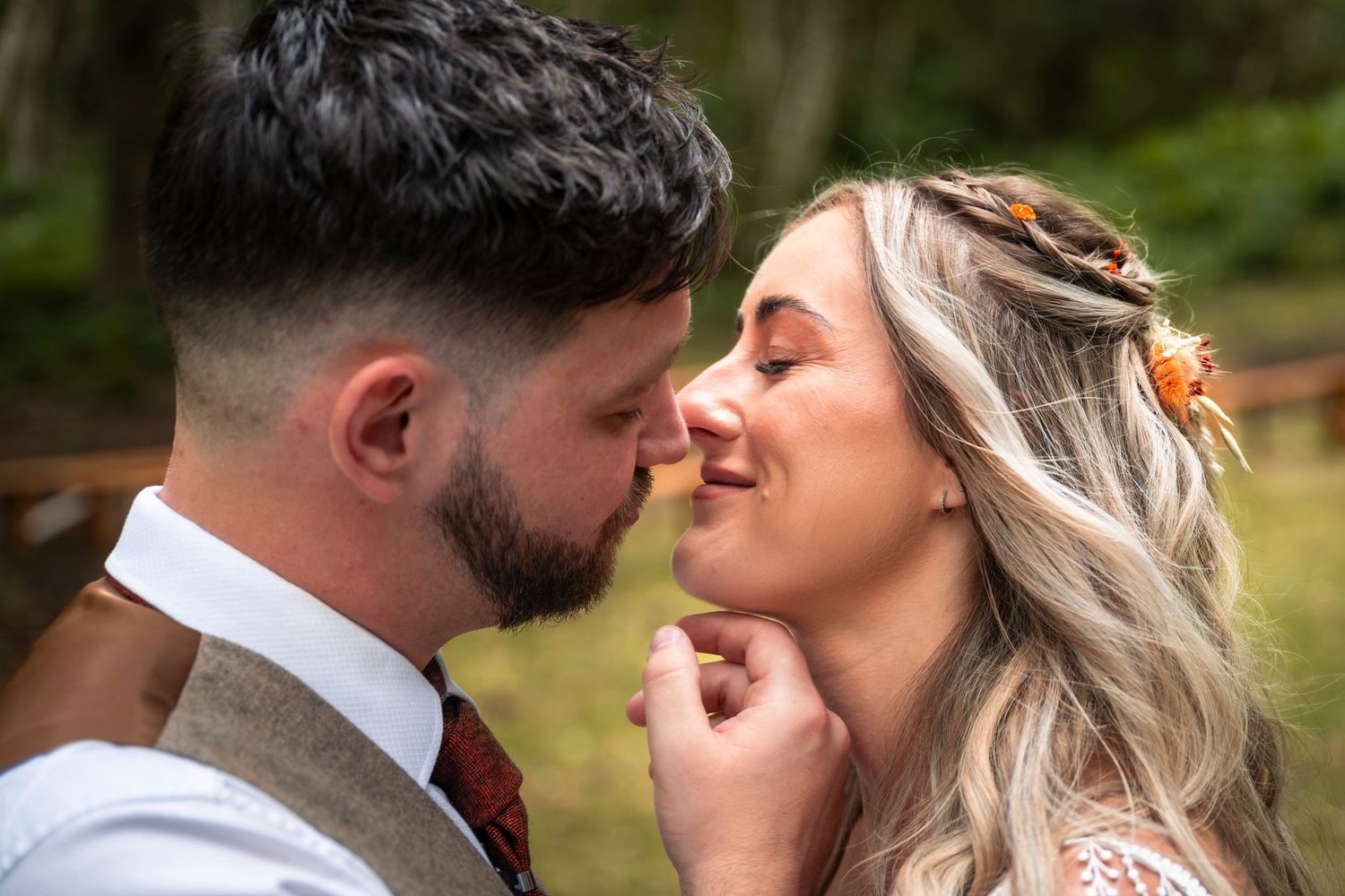Bride and groom kissing against an autumnal background. Bohemian style. Sherwood Glades, Nottingham