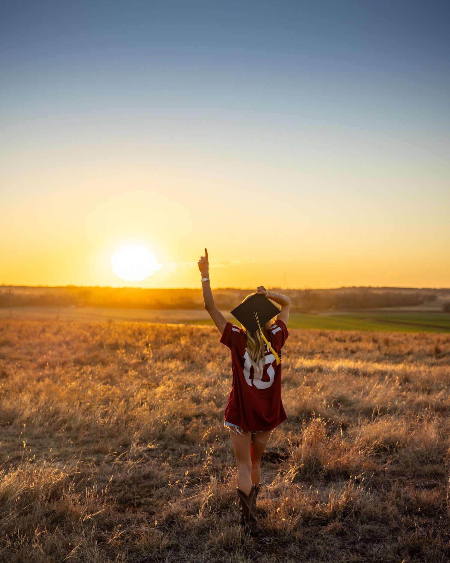 A sequence of sunset photos shows a person jumping and dancing in a golden wheat field during magic hour.