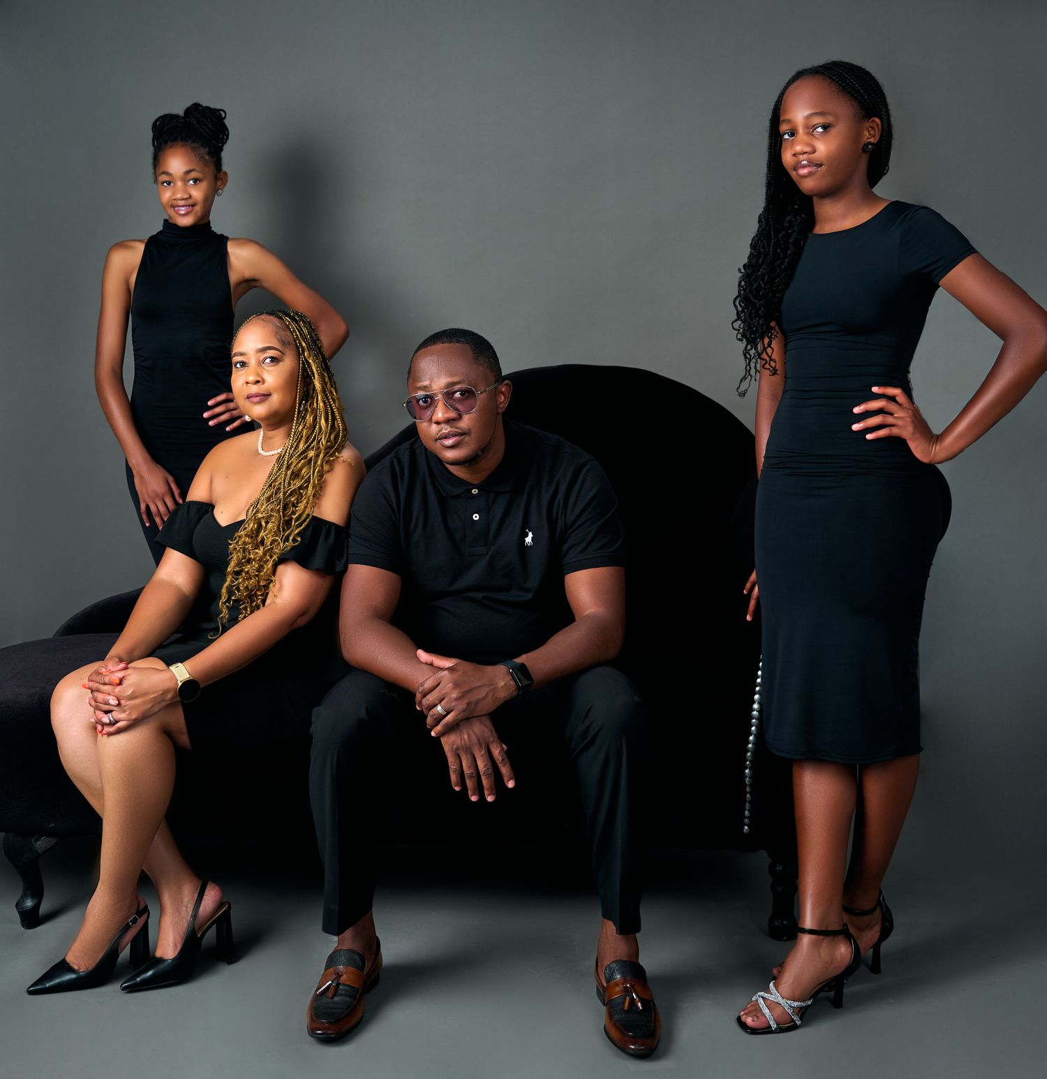 family in black posing