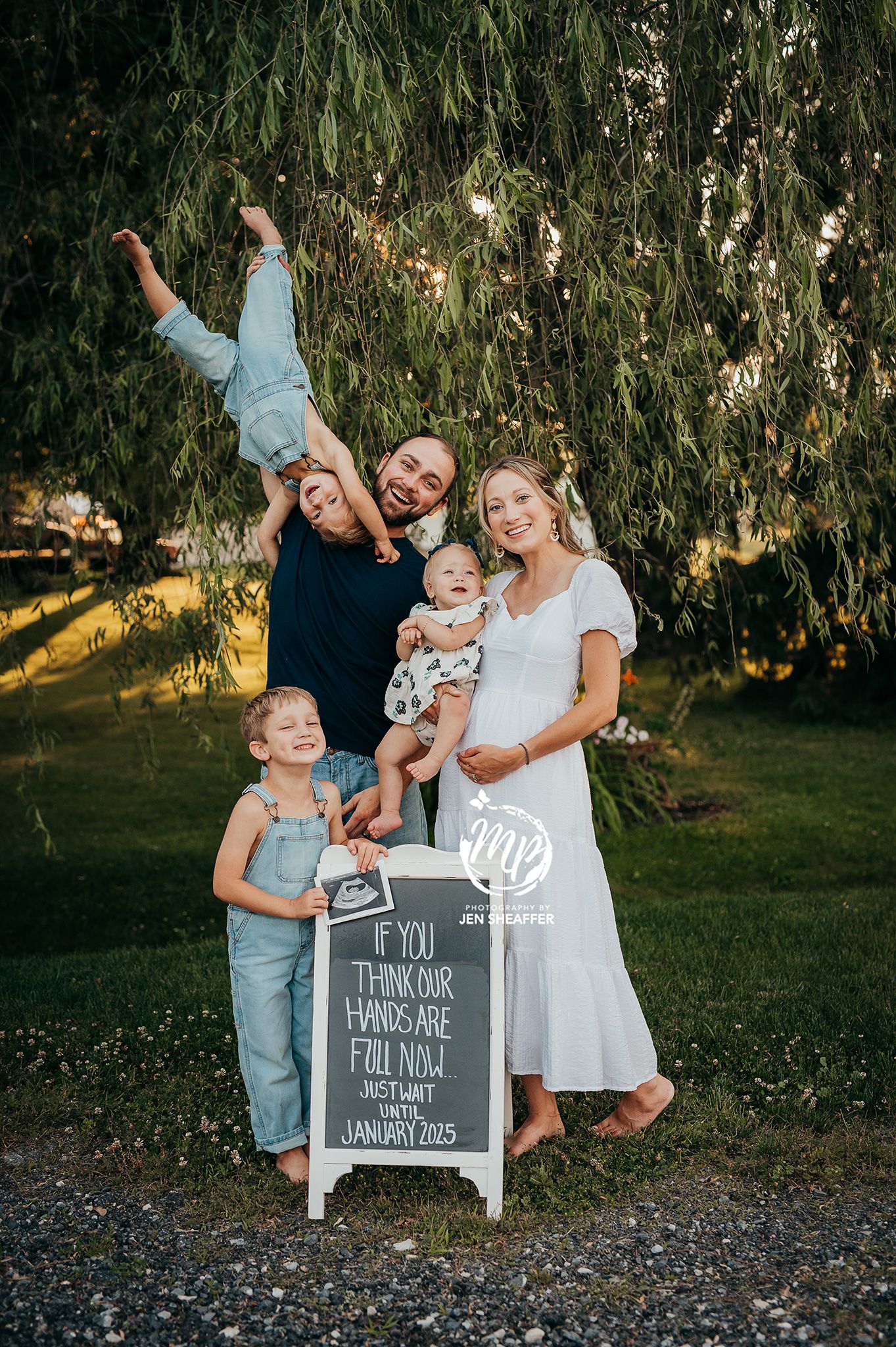 Family announcing they are expecting a new baby maternity