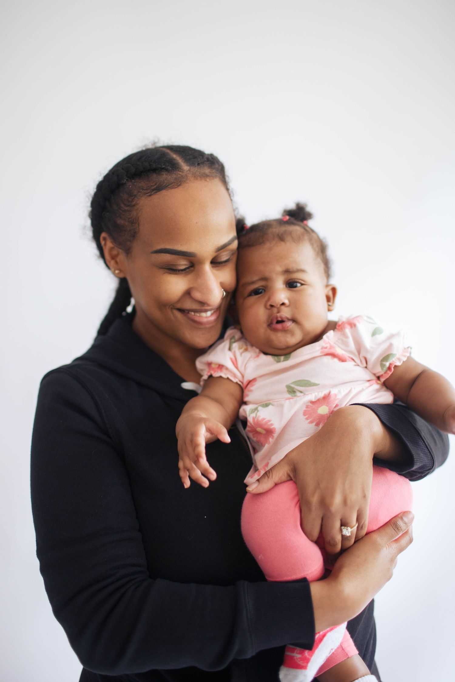 Edmonds family photographer: A mother with her baby daughter at photo shoot indoors