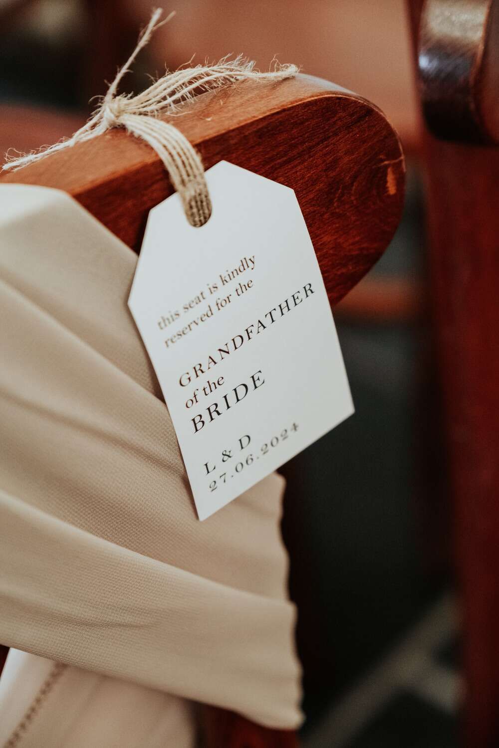 Reserved seat tag for the bride's grandfather with the date "27.06.2024."