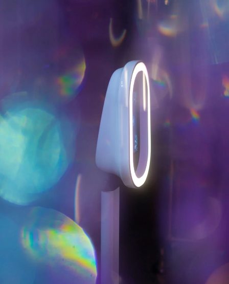 Abstract light reflections with purple and blue tones creating ethereal bokeh effect.