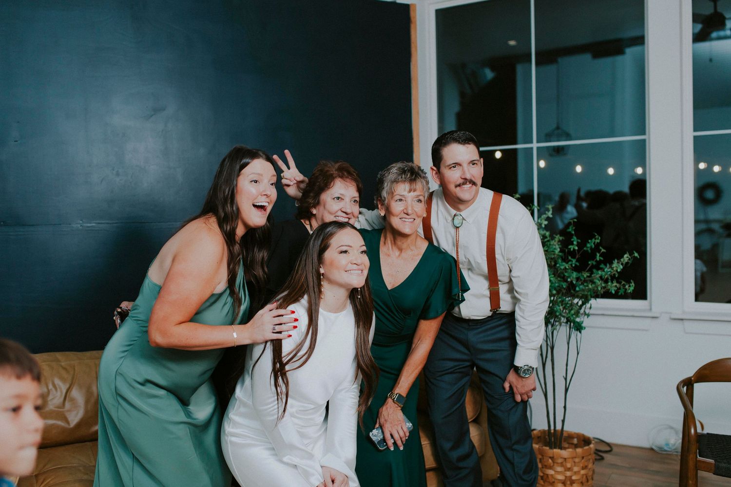 Candid moments of friends laughing together in a contemporary studio setting with natural light.