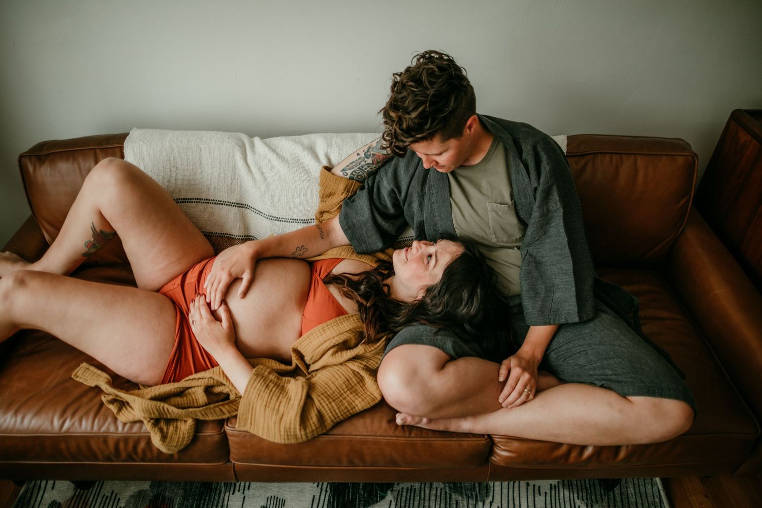queer couple getting lost in a moment during maternity photography session portland oregon rushes & waves
