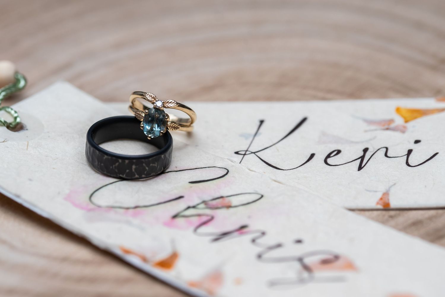 Handwritten calligraphy details on wedding stationery with decorative elements.