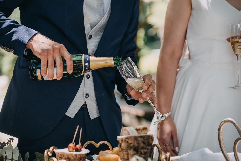 Close-up of champagne being poured at wedding reception.