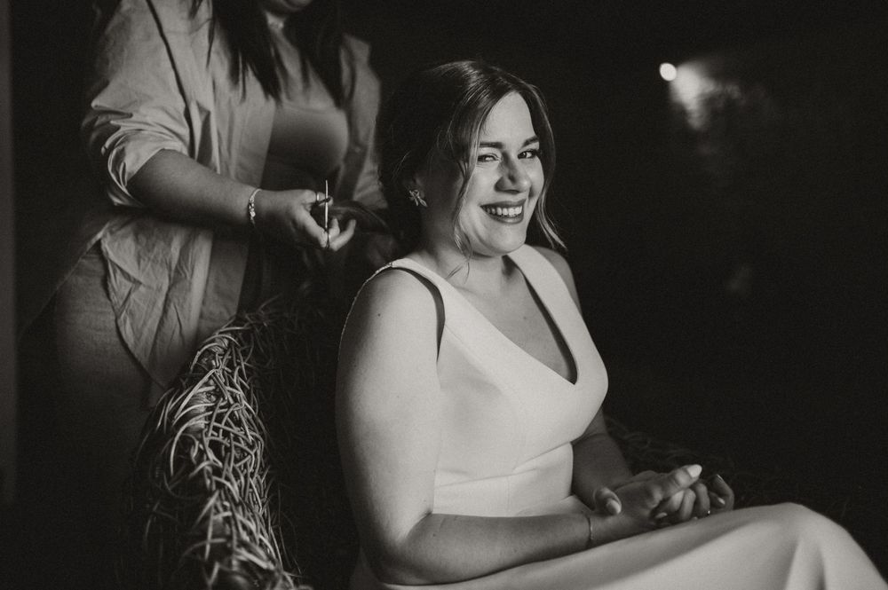 Black and white photo showing preparation moments during a special event.