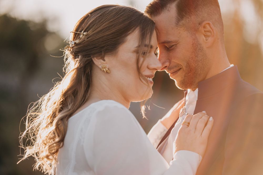 An intimate moment captured between a couple during golden hour.