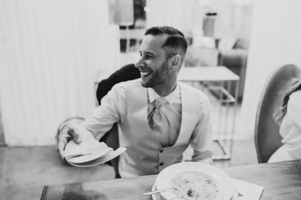 Black and white portrait captured during a wedding reception celebration.