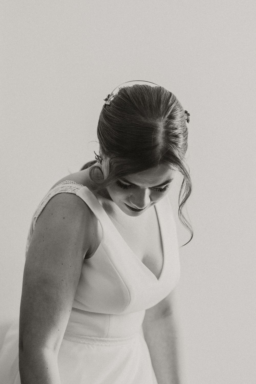 Artistic black and white portrait showing elegant bridal details.