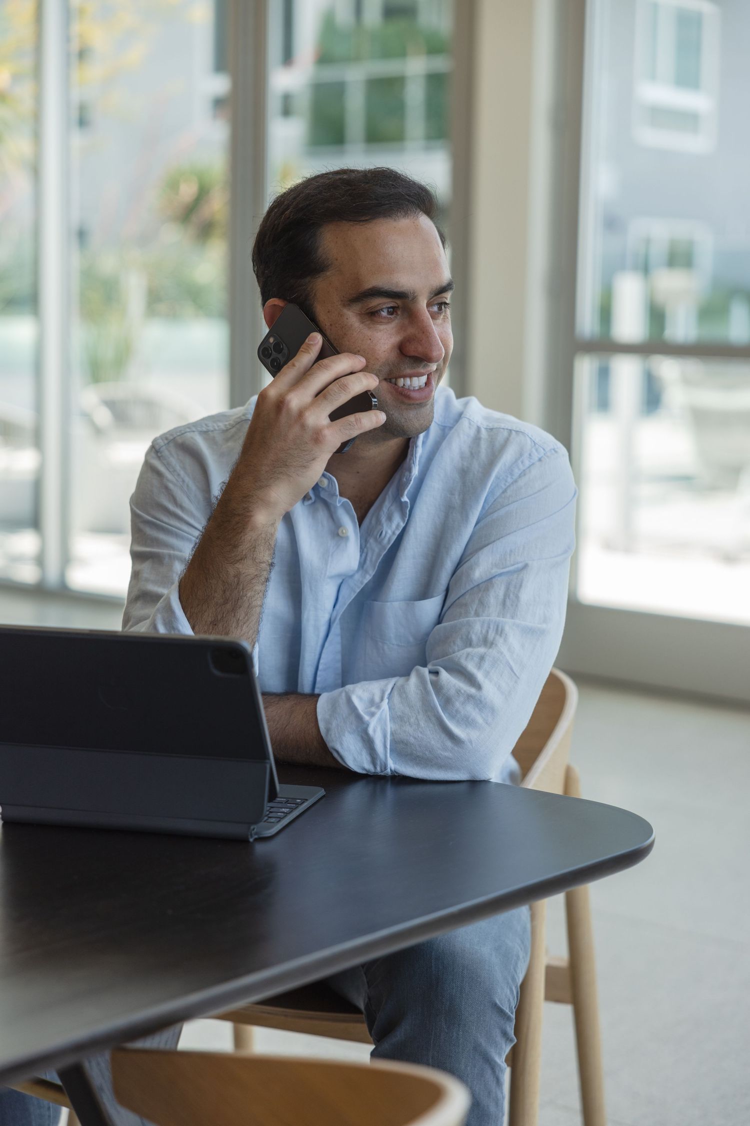 Image of a realtor speaking with a client on his cellphone.