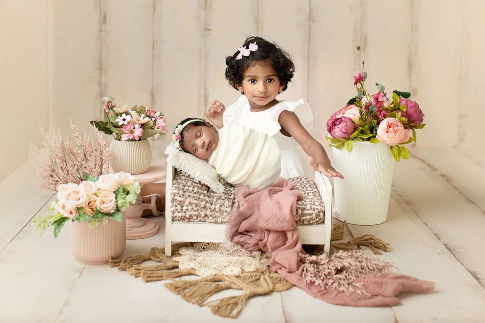 "Adorable newborn baby swaddled in prop peacefully sleeping. captured by a female photographer in Doha, qatar
