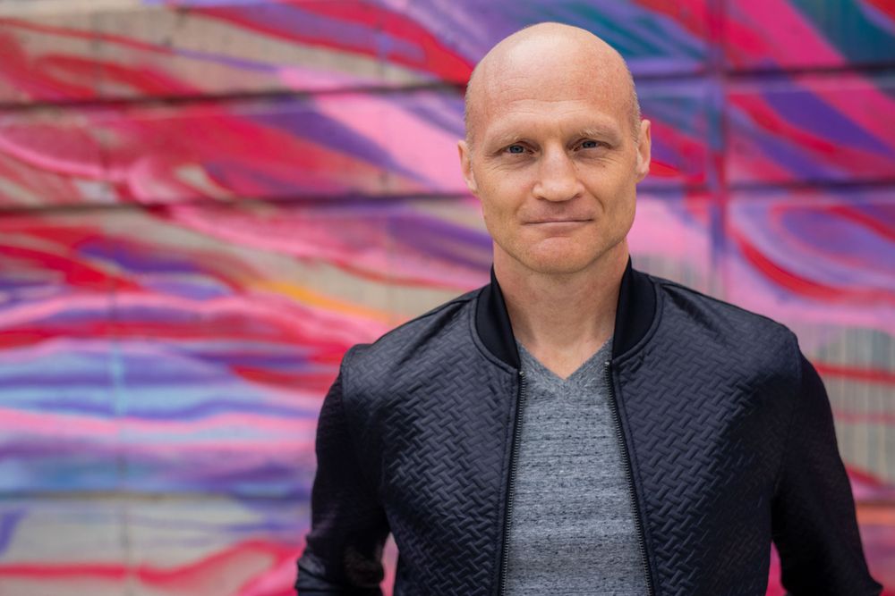 Author portrait in front of colorful wall in Scottsdale, AZ