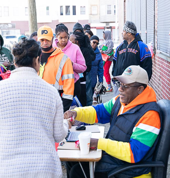 Pixs by Tina captured people gathering at a community pantry, receiving food distribution and community