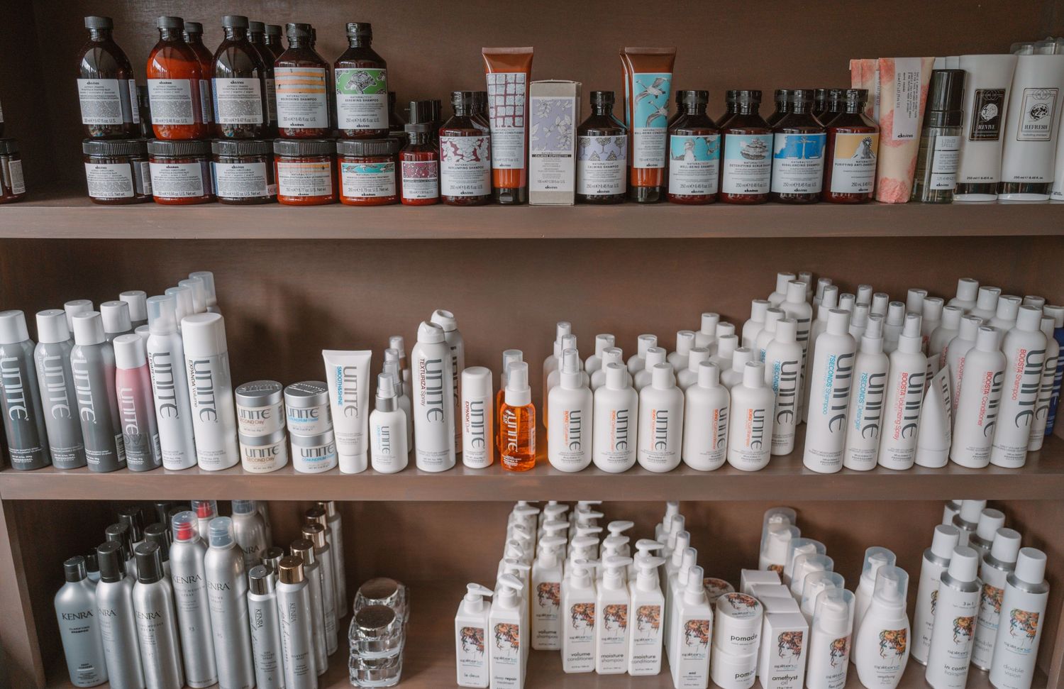 Organized shelves displaying rows of professional beauty and skincare products.