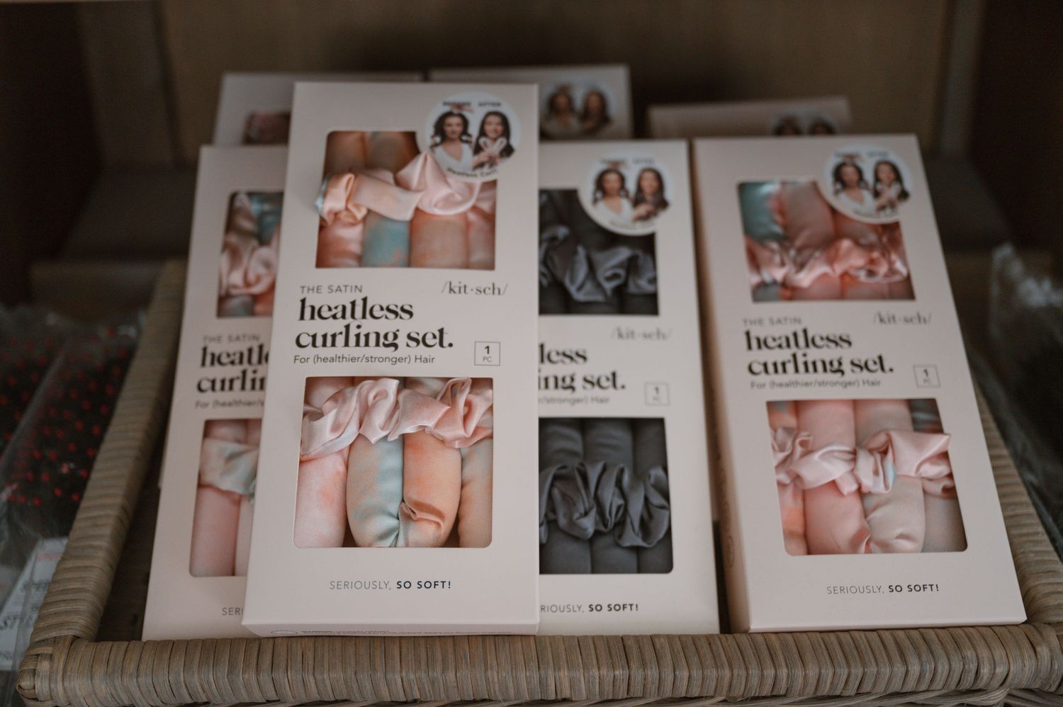 Multiple packages of heatless curling sets arranged on display.