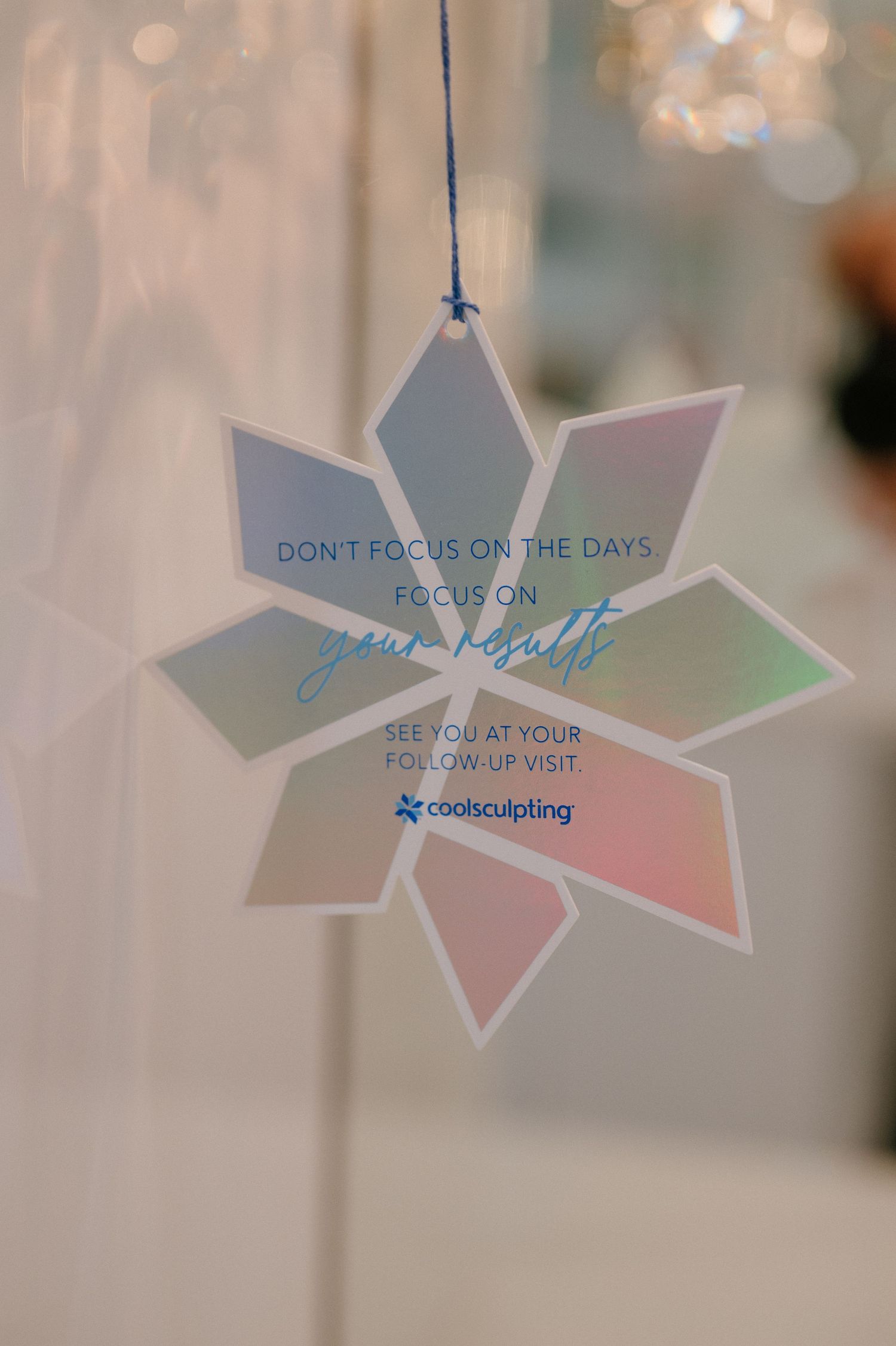 Decorative star-shaped hanging sign with motivational message in spa setting.