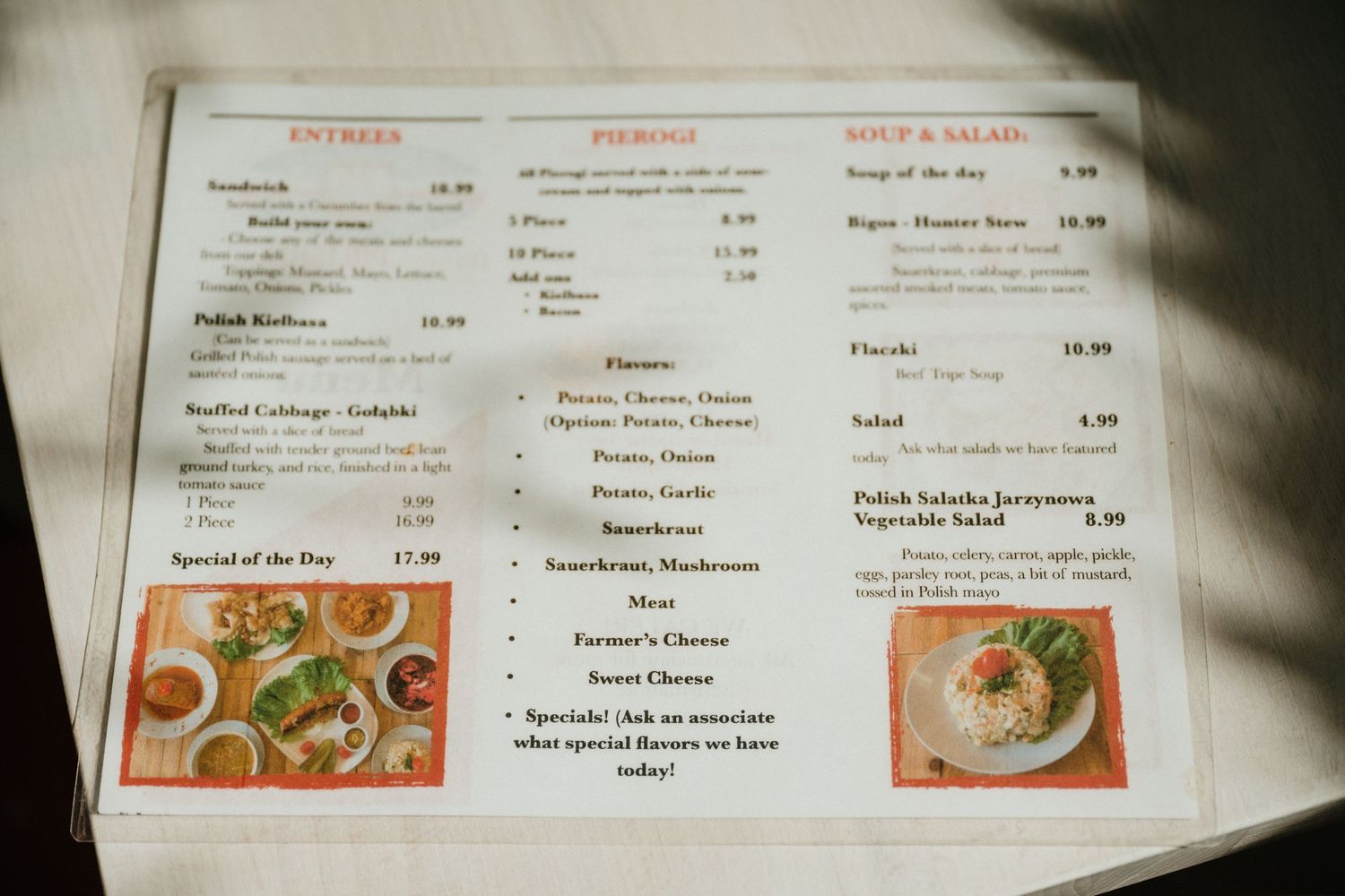 Restaurant menu showing entrees and beverages with food photos and pricing.