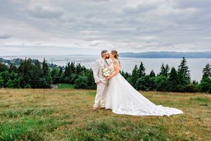 Bride and groom share romantic moments across scenic mountaintop meadow in series of wedding photographs.
