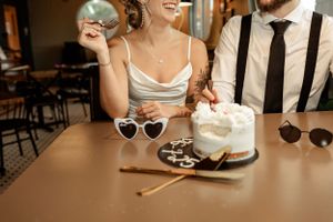 Close-up of dessert and sunglasses on table at retro diner.