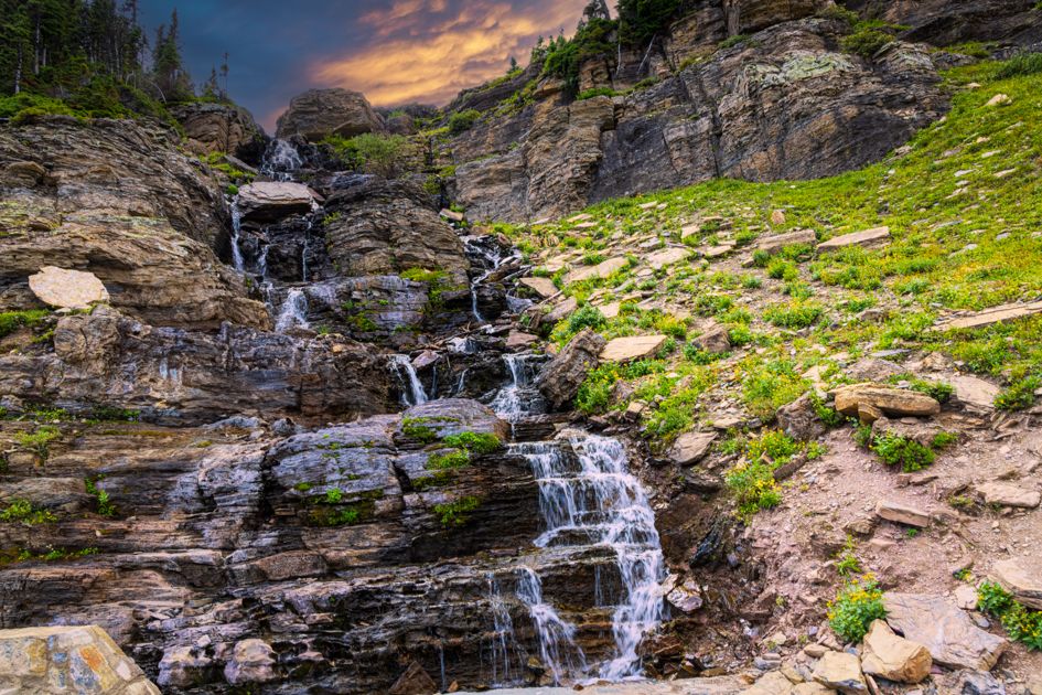 two waterfalls surrounded by fall colored trees