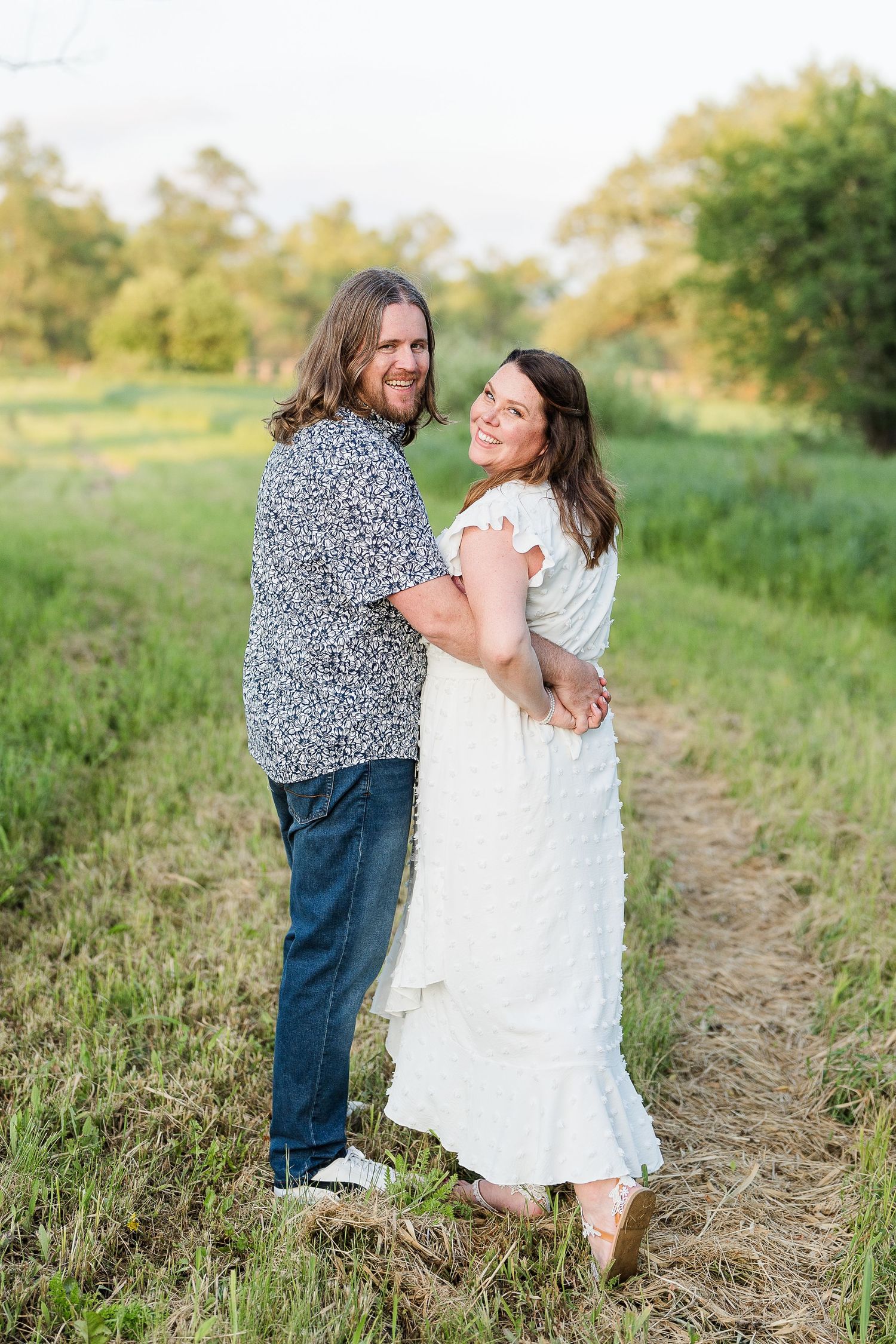 Engaged couple laughing and playfully interacting during their Kenosha engagement session.