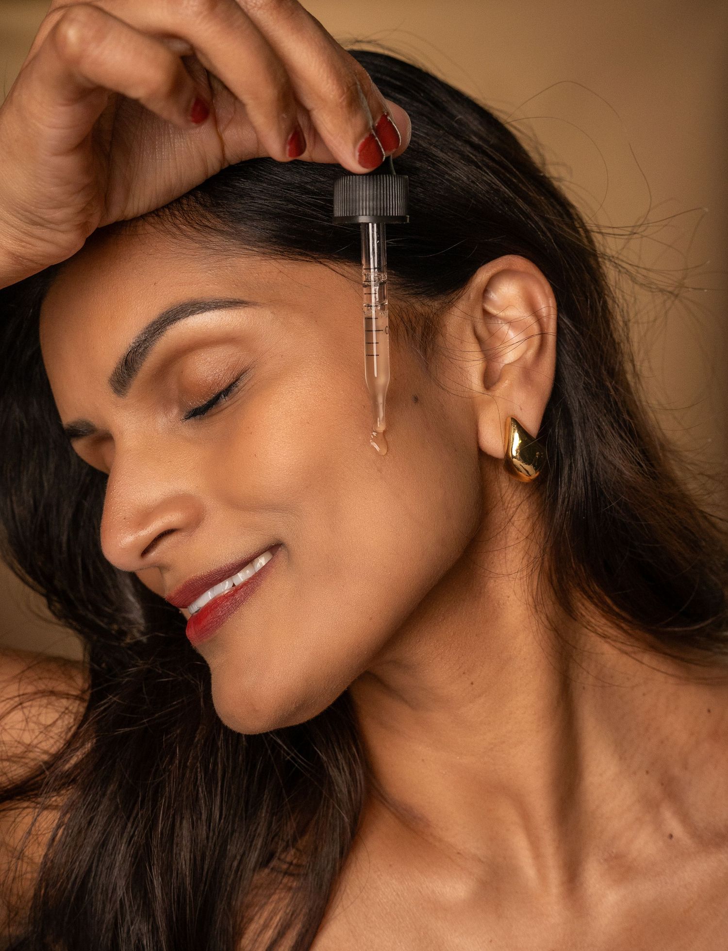 Jewelry styling photo shows multiple angles of an elegant silver earring in a woman's ear.