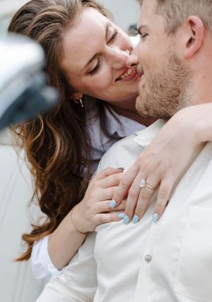 Close-up engagement photos showing tender moments and engagement ring.
