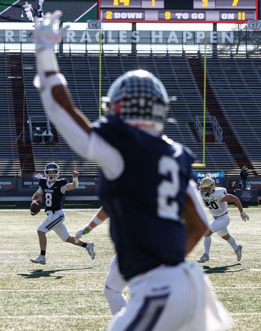 Kane Archer points at his receiver, football photo