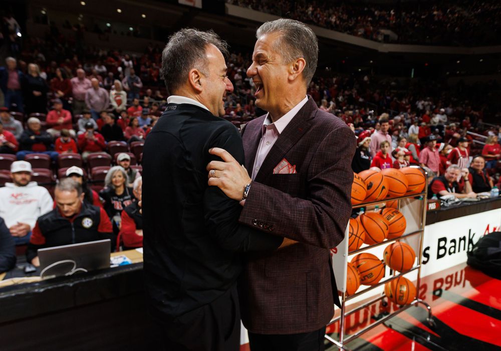 Jon Calipari shakes hands with UCA Head Coach John Shulman before their matchup