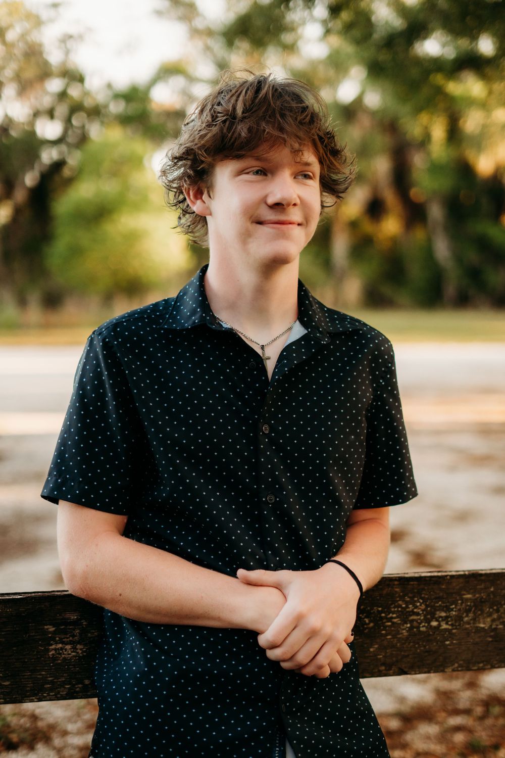 Graduating senior headshot at park.