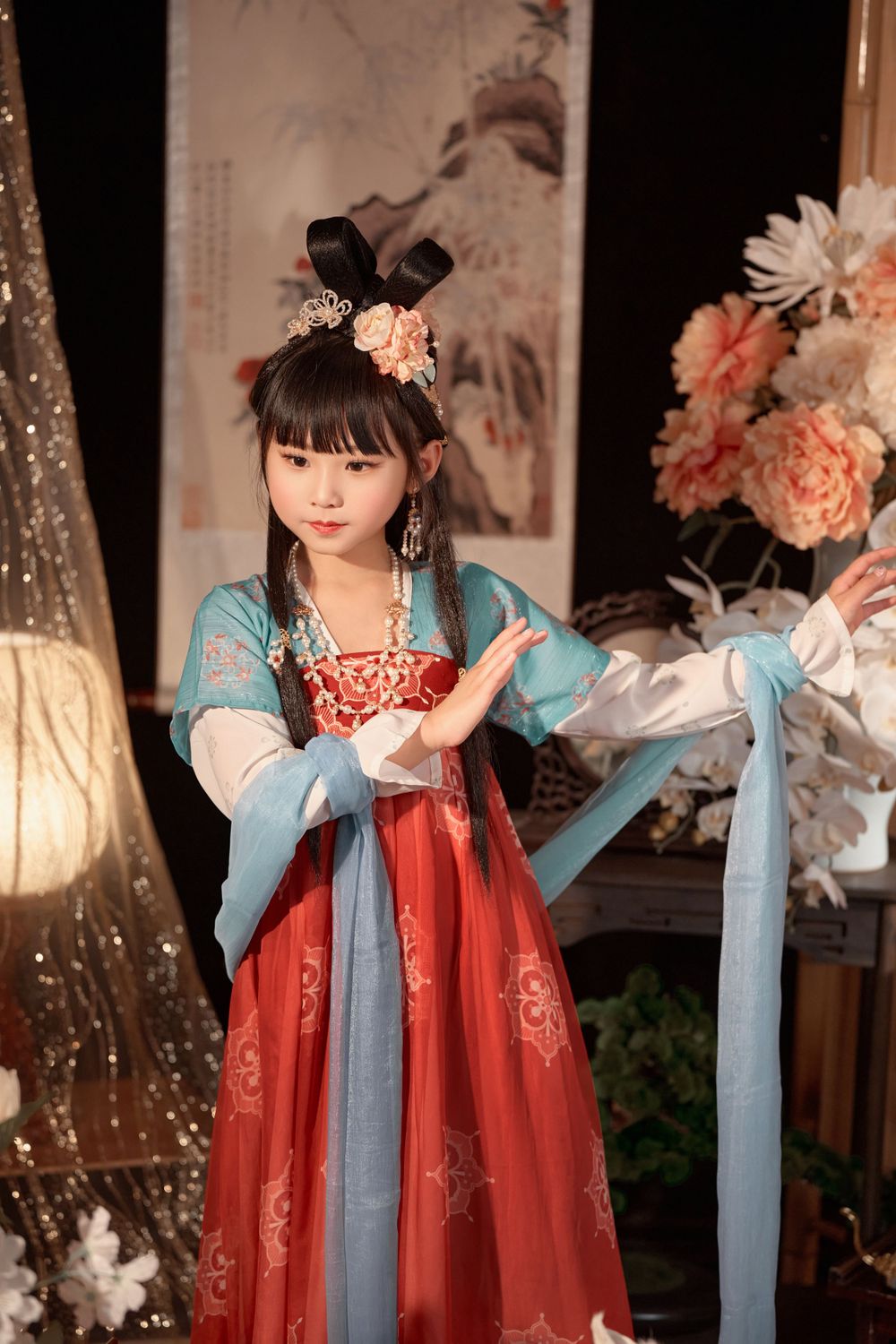 Cute children's studio portrait in an elegant Tang Dynasty Hanfu with dazzling golden props, by Imagine Image Studio.