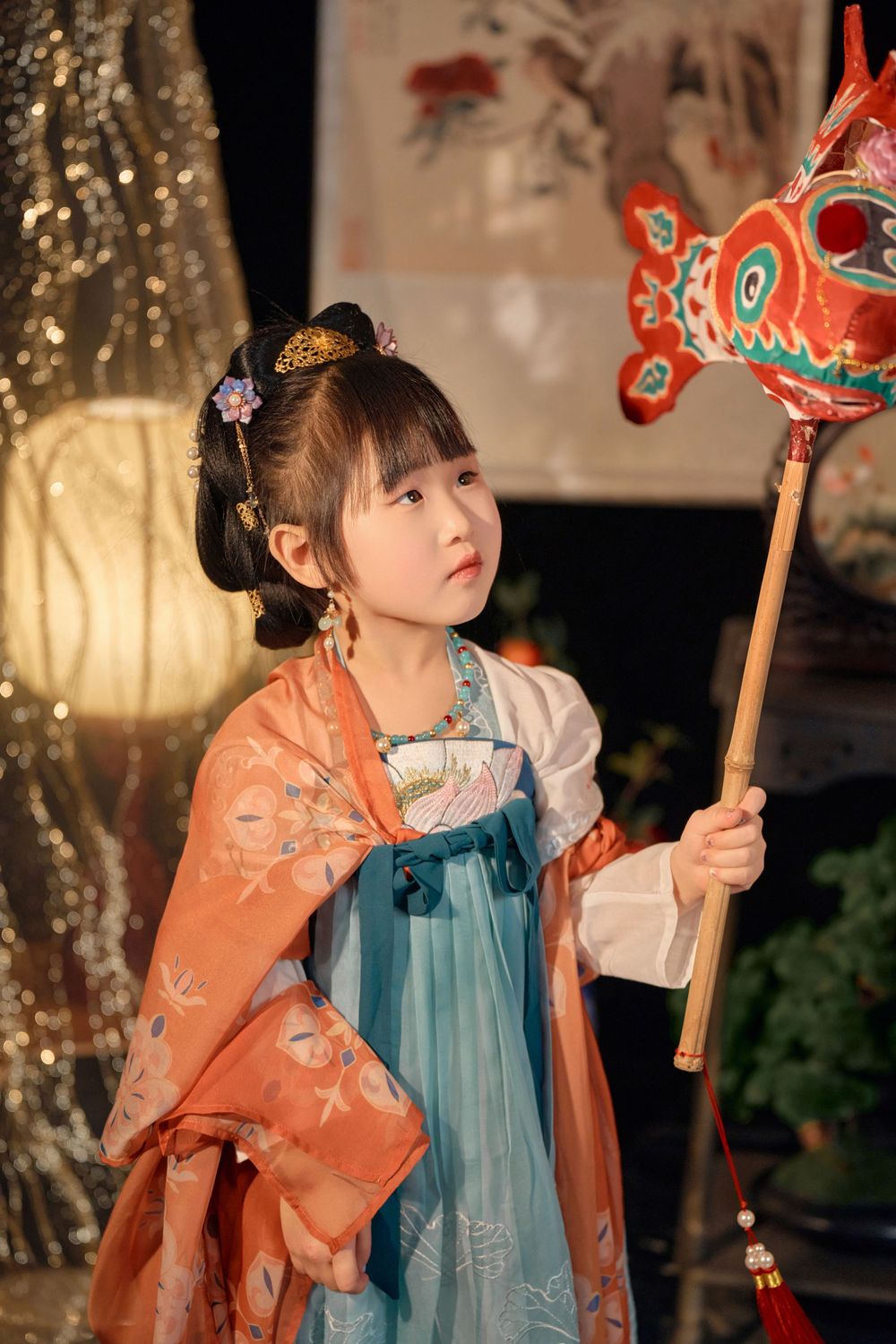 Magical kids Tang Dynasty Hanfu studio portrait featuring shiny golden props, by Auckland photographer Imagine Image Studio.
