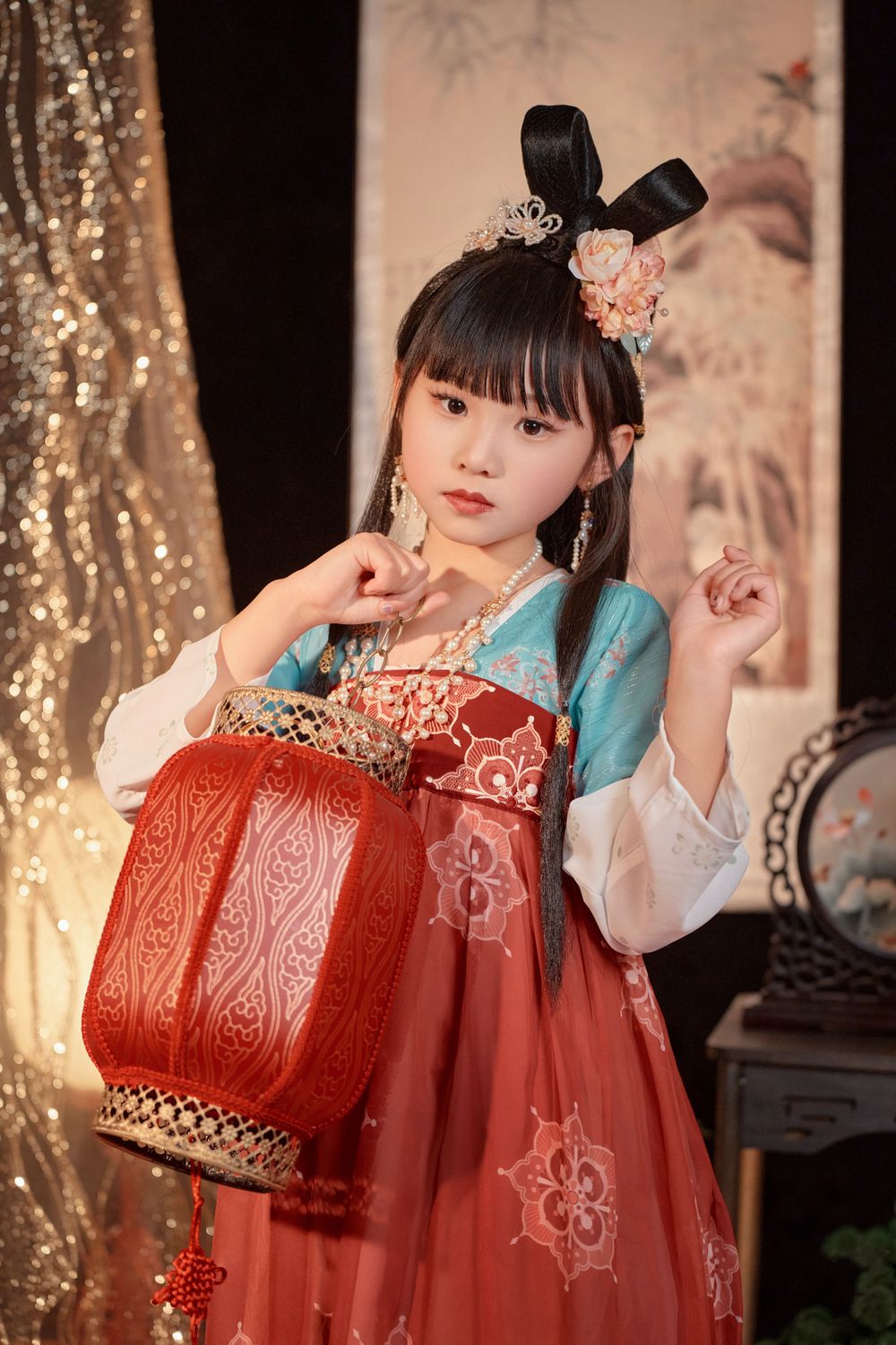 Magical kids Tang Dynasty Hanfu studio portrait featuring shiny golden props, by Auckland photographer Imagine Image Studio.