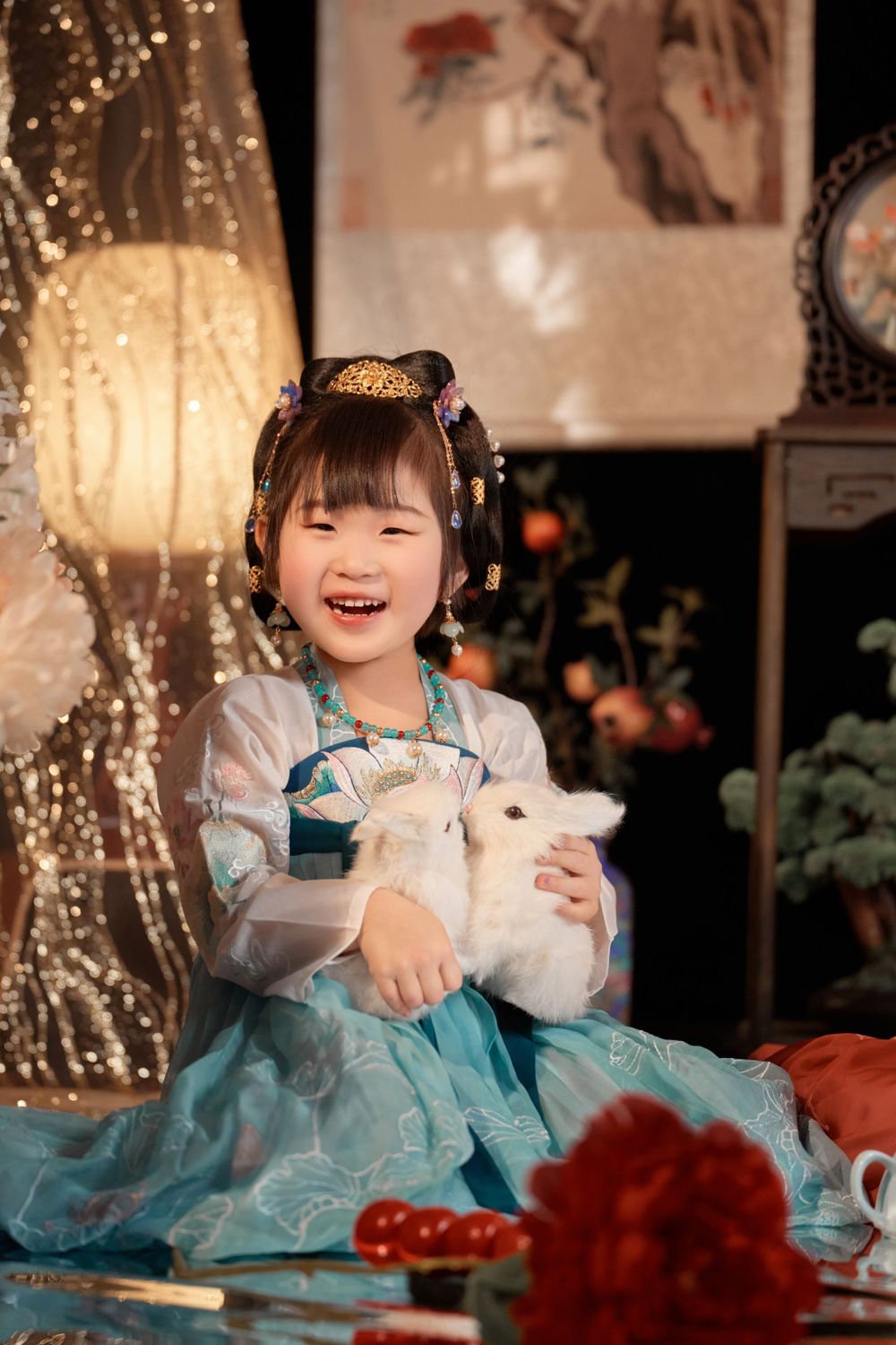 Magical kids Tang Dynasty Hanfu studio portrait featuring shiny golden props, by Auckland photographer Imagine Image Studio.