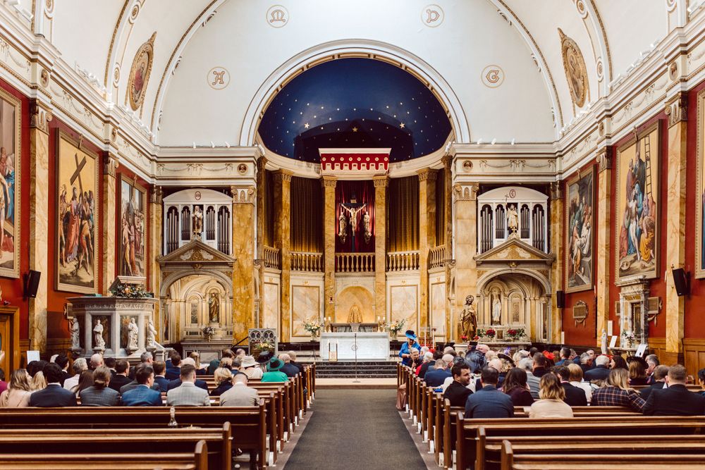 Elegant church sanctuary with vaulted ceiling and ornate architectural details.