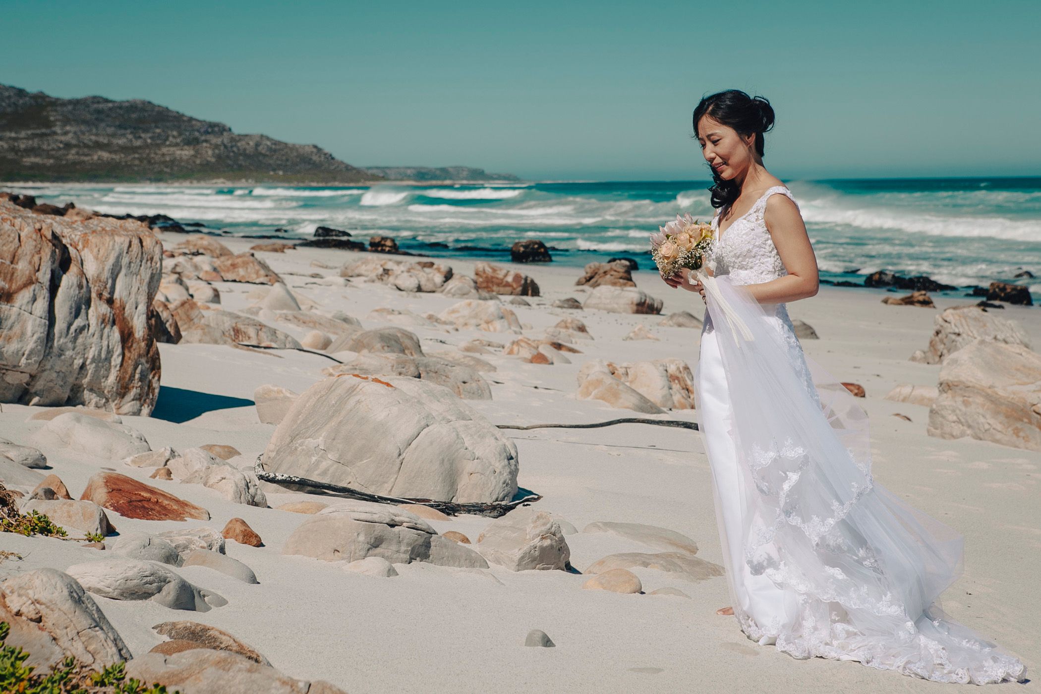 Beautiful bride Joowon, who married Craig in a relaxed ceremony on the beach at Misty Cliffs outside of Cape Town.