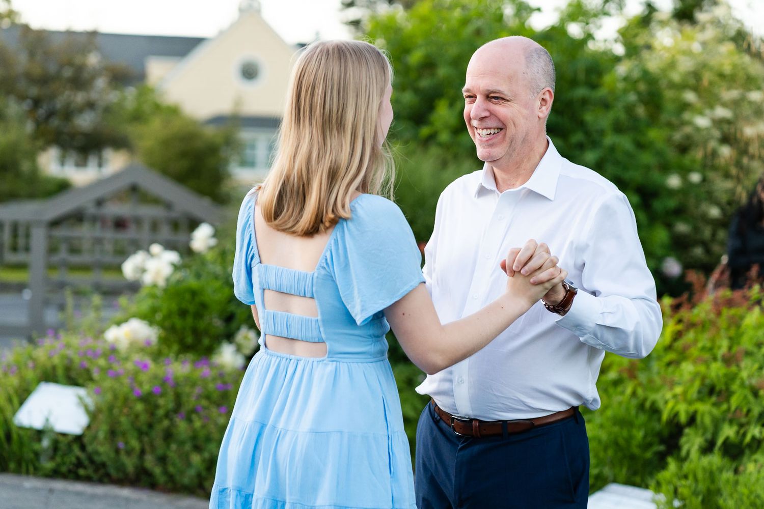 Father and daughter dance together at the Center for Urban Horticulture.