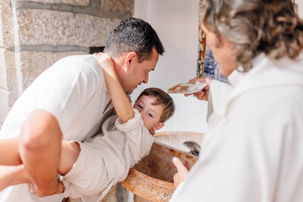 A playful interaction during a special ceremony indoors.