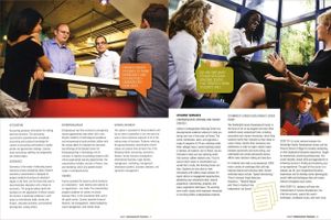 Business professionals engage in discussions at a modern office space in a university magazine feature.